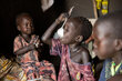  WFP/Samantha Reinders. Child eats a meal of walwal (porridge made from waterlily flour)  with his family, Bentiu South Sudan.