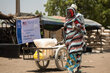 Yakura Usman, 70, receives food assistance at a distribution centre from where WFP provides life saving relief, including in-kind food rations, electronic food vouchers, and specialized nutrition support for vulnerable households and internally displaced persons in Dikwa, Borno State, Nigeria.