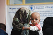 Photo: WFP/Mohammad Hasib Hazinyar. A mother with her daughter come to the Bagrami clinic which is under WFP support on malnutrition activities. she has brought her malnourished daughter to the clinic to get WFP's support and malnutrition supplementary. Kabul, Afghanistan.