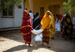 Photo: WFP/Abubakar Garelnabei. WFP distributes emergency assistance to people who are seeking refuge in Osma Degna School in Port Sudan after conflict spilled over into Gezira State.