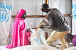 WFP/Michael Tewelde.  a pregnant women  displaced from Sudan, Khartoum seen walking with the food received from WFP  at Ura, refugee camp Benishangul-Gumuz region of Ethiopia.
