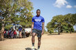 Photo: WFP/Nkole Mwape, soccer player Patson Daka visiting on a field visit in Zambia.