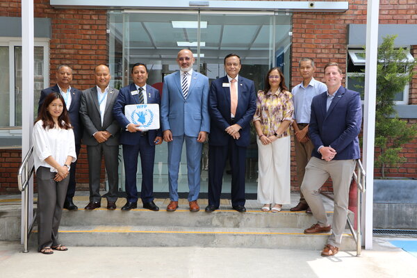 WFP, Lions Clubs International Foundation, and World Food Program USA representatives at an announcement of a strategic partnership to scale up home-grown school feeding in Nepal.