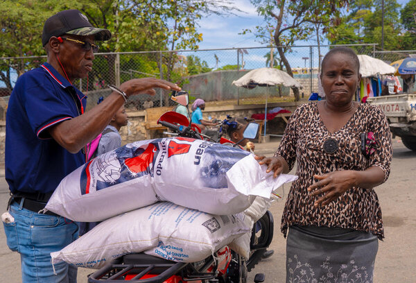 Photo: WFP/Luc Junior Segur. WFP provides financial assistance  including mobile cash transfers to more than 26,000 households in Canapé Vert. 