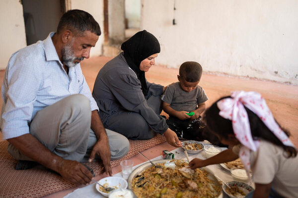 Photo: WFP/Hugh Rutherford. WFP, in collaboration with UNRWA, has been delivering food parcels to Bedouin communities in Area C. Recently, Um Al Khair families transitioned to a hybrid assistance model combining food vouchers and in-kind parcels, ensuring access to essential food items amid escalating protection risks.