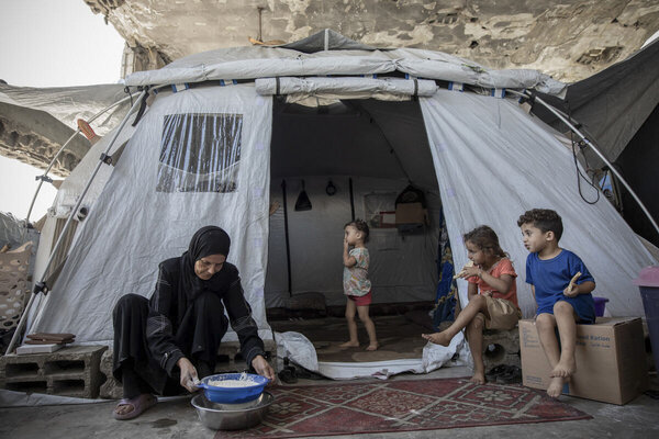 Photo: WFP/Mohamed Hinnawi. "We spent a whole week without bread. This bag of flour means everything to me. It means life," says a woman, who now lives in displacement in Al Saraya Camp after losing three sons, her husband, and her home during the war. With no steady income, food assistance helps her bake bread and prepare simple meals from flour, rice, lentils, and chickpeas.
