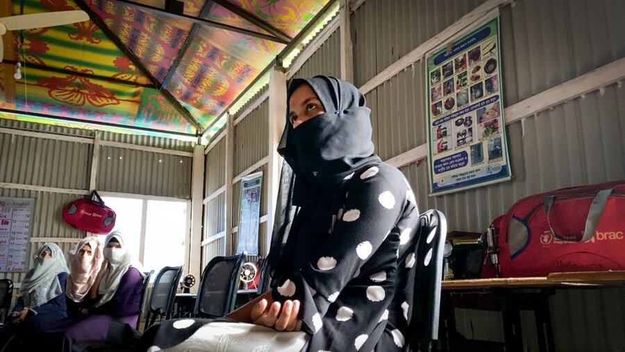 a woman is sitting in a chair