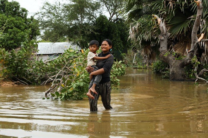 a woman is passing through water