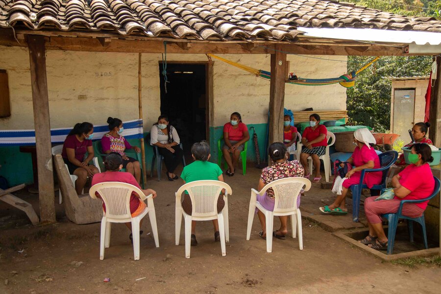a group of people are sitting