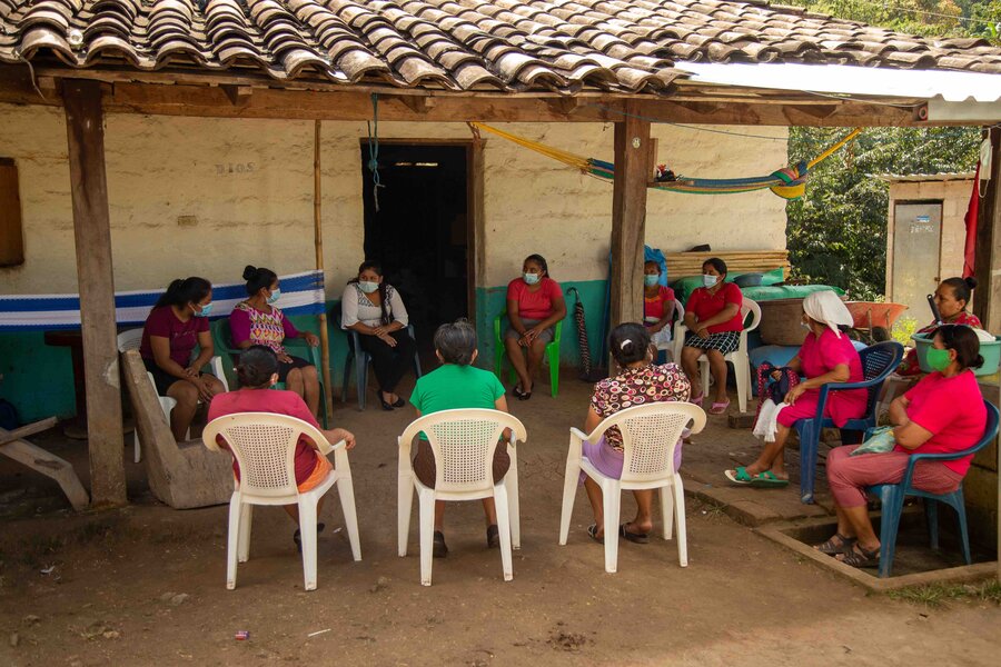 a group of people are sitting 