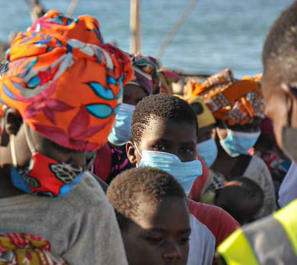 Families line up at the port town of Pemba in Cabo Delgado in October — 500,000 people were displaced in Mozambique in 2020. Photo: WFP/Sean Rajman