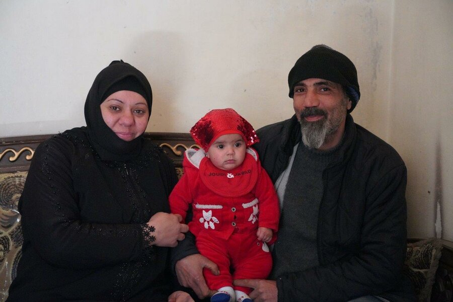 Abo Hashim, his wife Noor and baby Shaghaf at their home in Aleppo. 