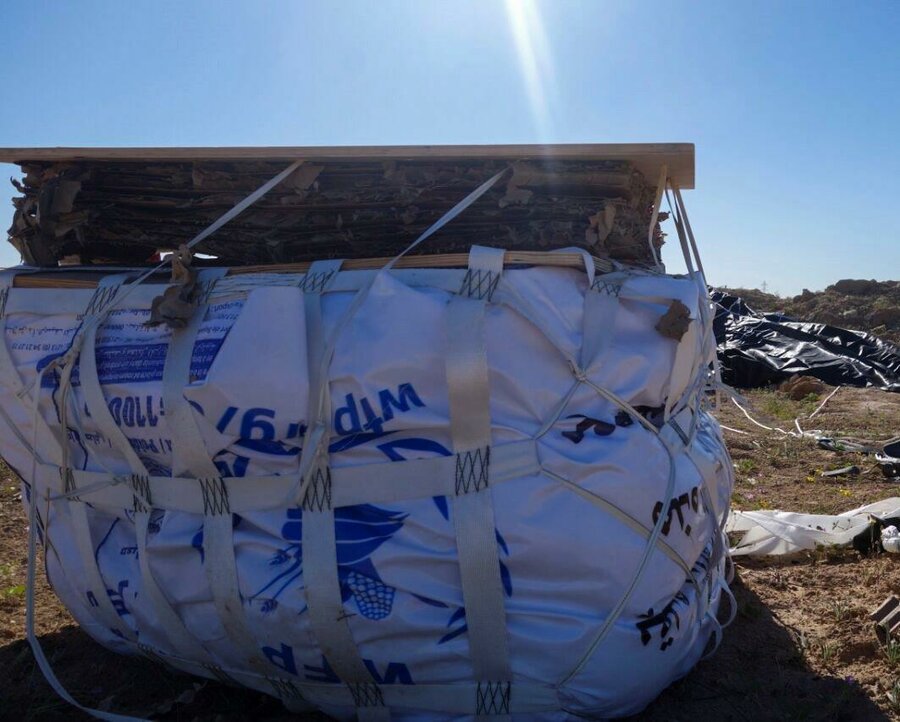 WFP food palette dropped from high altitude lies in an empty land in Deir Ezzor.