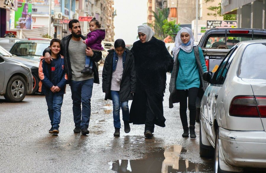 Shady walks with his parents and three sisters down the street in Egypt's Mediterranean city of Alexandria 