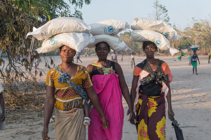 Women carrying WFP supplies