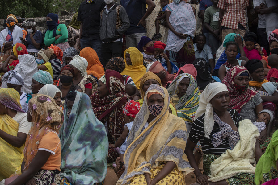 Women sitting together- waiting to be evacuated by UNHAS flights