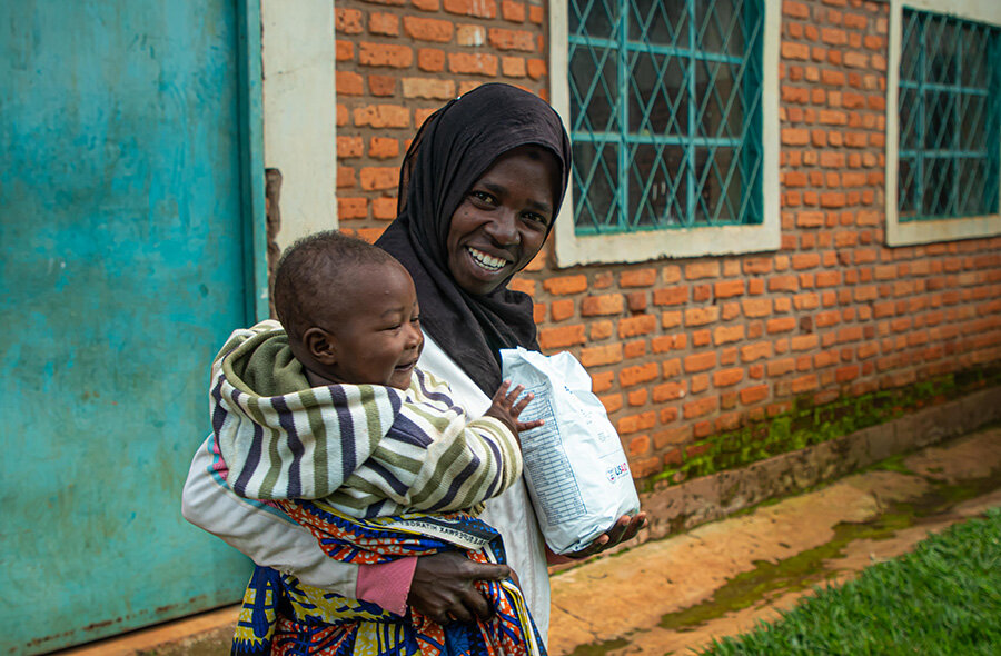 Irakoze poses for a picture with her son Idrissa after making a recovery from malnutrition. Photo: WFP/Aurore Ishimwe