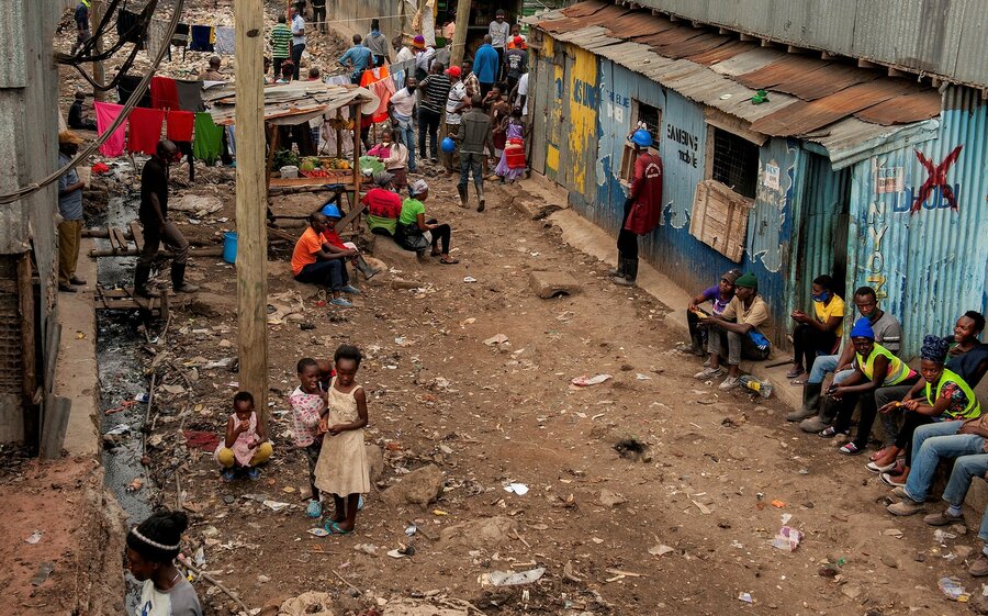 Residents gather on the streets of the Mukuru Kwa Reuben informal urban settlement in Nairobi. Photo: WFP/Alessandro Abbonizio