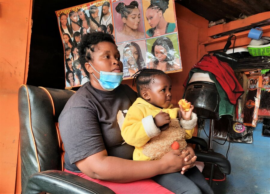 Mary Wanjiku, who received four cash transfers from WFP, is a beautician in Kibagare village in Nairobi. Photo: WFP/Martin Karimi