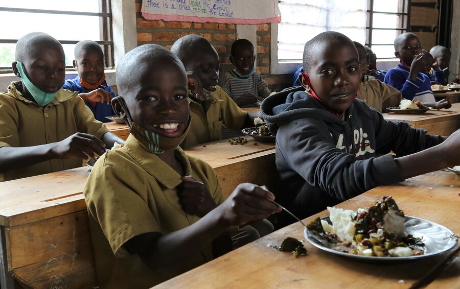 Nine year old Donat enjoys a WFP-provided school meal with classmates. Photo: WFP/Emily Frendenberg