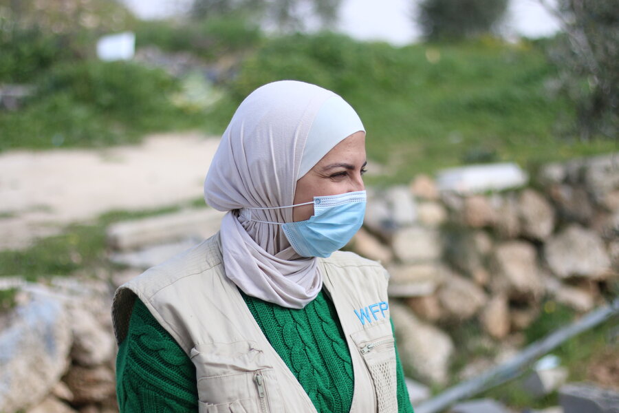 Woman wearing mask looking sideways