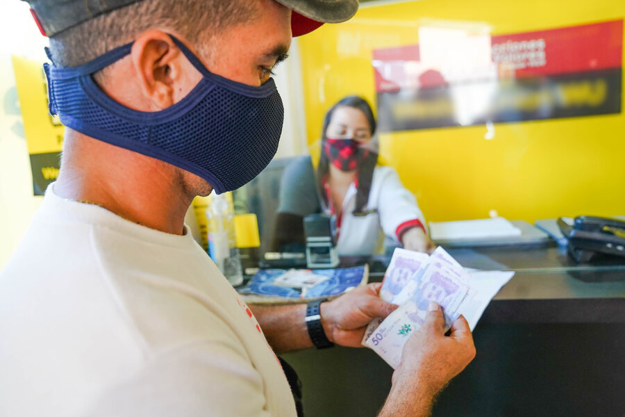 Jose recives his cash transfer in Arauca
