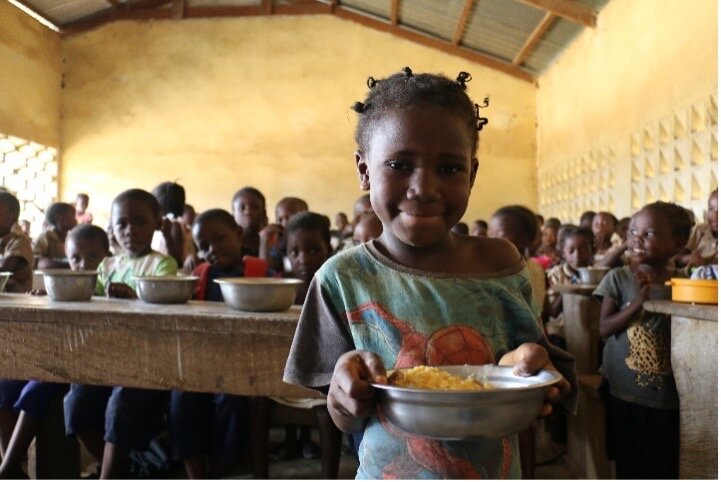 Child holding plate