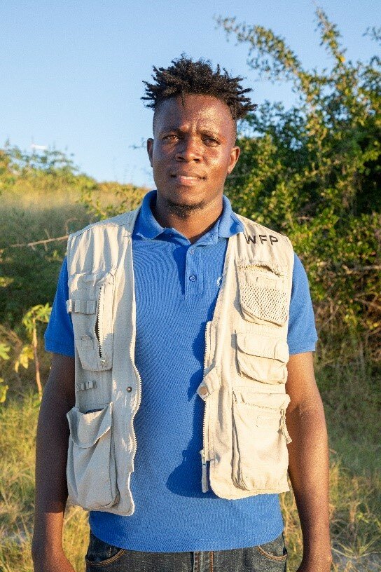 A man in a WFP uniform stands looking straight into the camera.