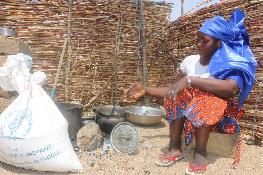 Woman sat and preparing food