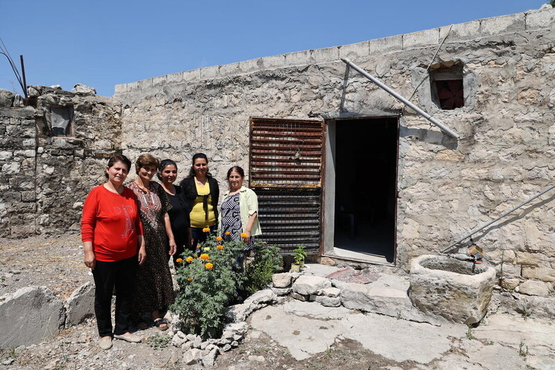 The women gather at Heyam’s house to plan and build their business.