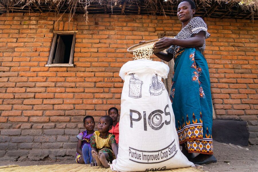 Woman adding beans to bag