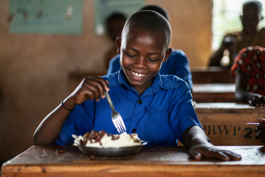 a school girl is eating her meal