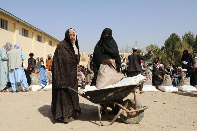 Two women receive WFP food assistance in Aghanistan