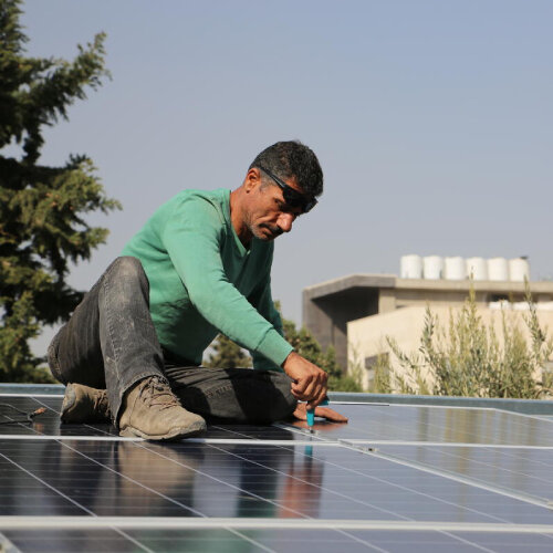 a man is working on roof