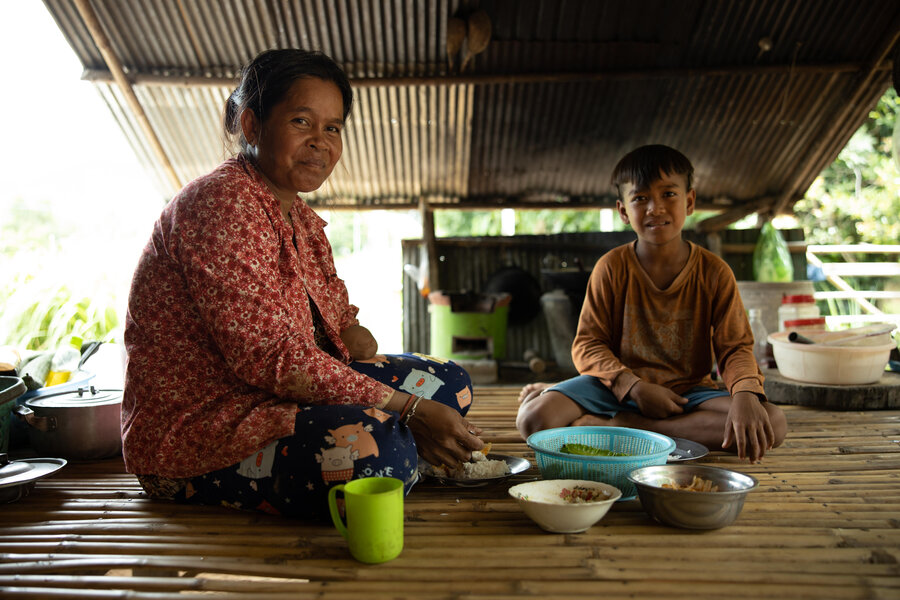 Nach Pov and her son Mouy Mai, 11, at home.