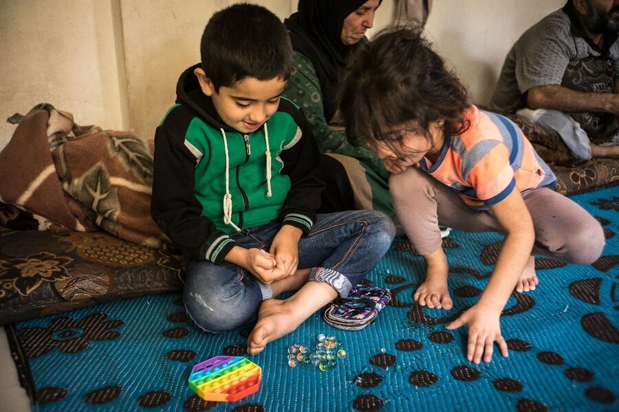 6-year-old Amin and his sister 5-year-old sister Tasmine play together at home.