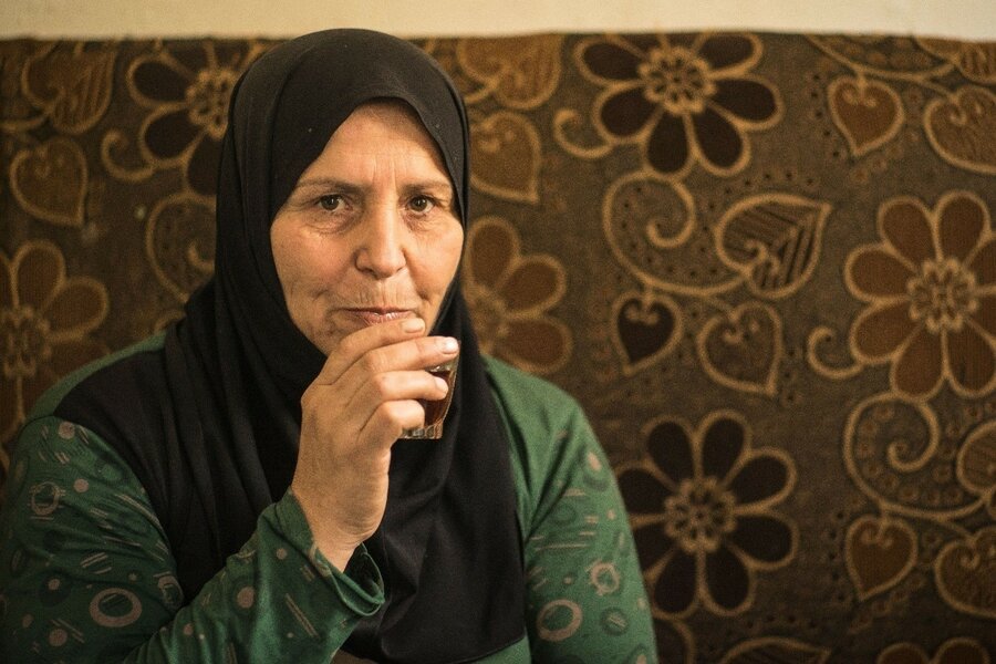 Rokati sips her tea, which is her lunch, as she shares her thoughts on the importance of preserving community relations through humanitarian assistance to the local population in need.