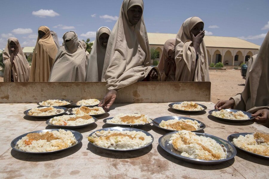 Schoolgirls at lunchtime at a school supported by WFP in 2019. Photo: WFP/Madelene Cronjé