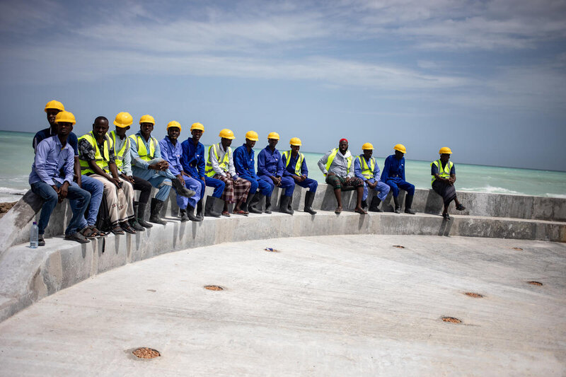 Workers on a new fishing jetty in Hobyo, Somalia, in September, built with support from WFP. Photo: WFP/Arete/Ismail Taxta 