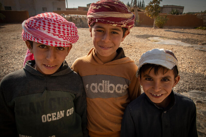 Three of Khalaf and Zuhayya’s children on their farm in rural Aleppo