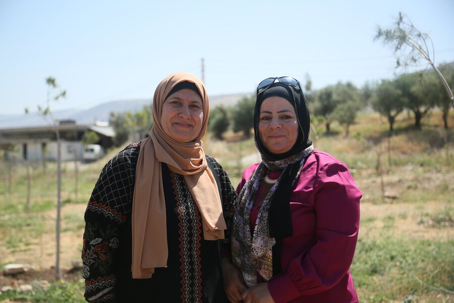 Ghada and Aesha began as colleagues but became friends while planting trees. Photo: WFP/Mustapha Ghabris