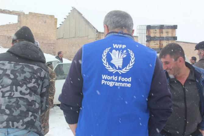 WFP Armenia Programme Assistant helping the community members with the transportation of the irrigation systems. Photo credits: WFP/Mariam Avetisyan