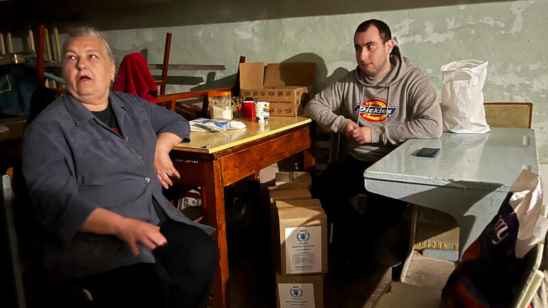 An elderly woman and her grandson who is in her thirties at a basement shelter in Kharkiv city, Ukraine.