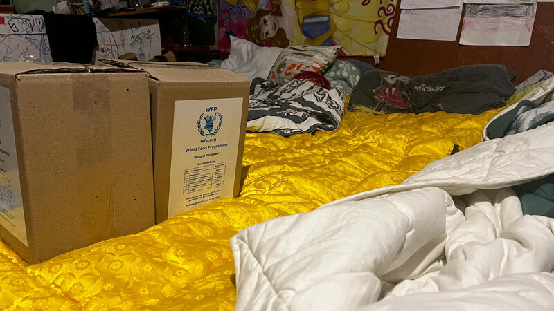 WFP food on mattresses against the wall of a basement shelter in Kharkiv city, Ukraine.