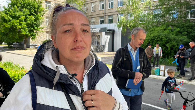 An mother is emotional outside a basement shelter in Kharkiv city, Ukraine.