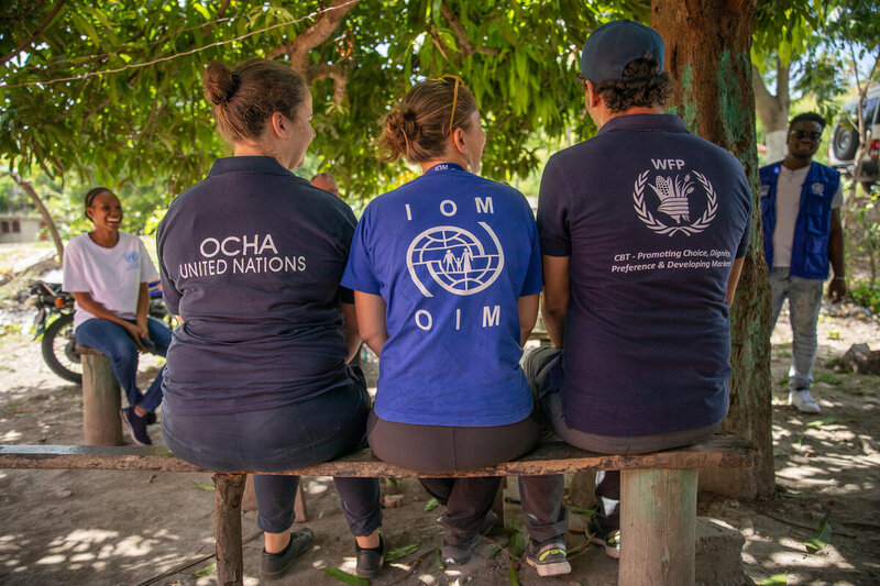 UN agency workers take a break at displacement camp in the wake of the Haiti earthquake in August last year