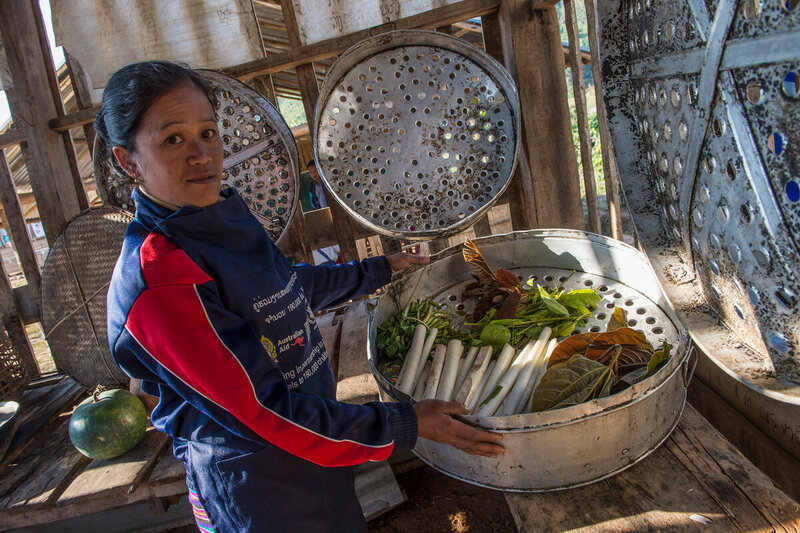 A meal is prepared for primary school children in a village of Beng district, Oudomxay, in Lao People's Democratic Republic in 2017. Photo: WFP/Rein Skullerud 