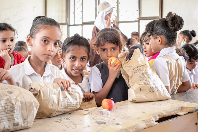 Children at a school in Aden receive meals as part of a WFP programme. Photo: WFP/Hebatallah Munassar
