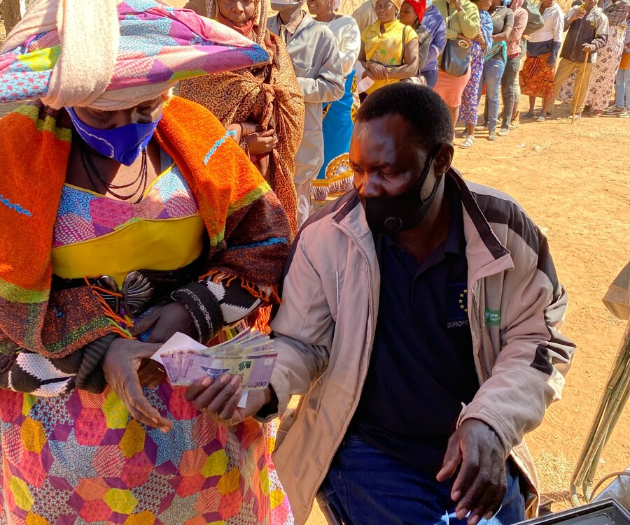 A woman verifies her WFP cash transfer. Photo: WFP/Luise Shikongo