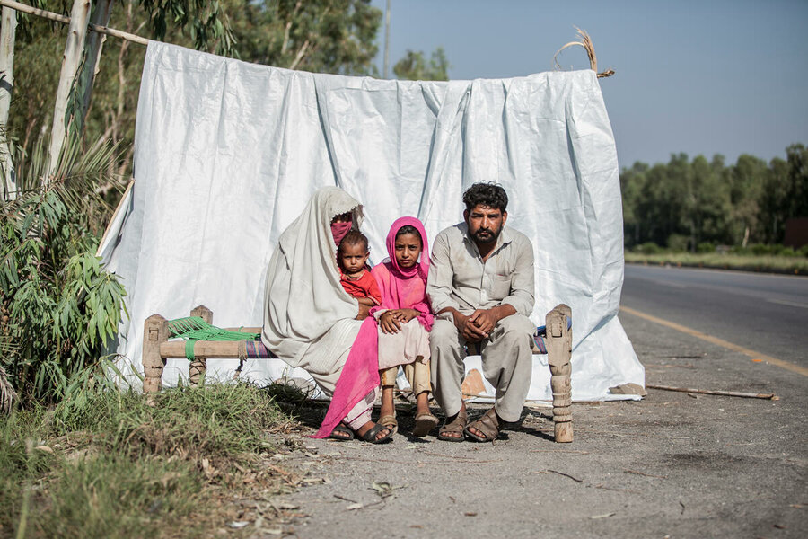 A family make do with next to nothing on the roadside in the wake of floods in Charsadda in Khyber Pakhtunkhwa